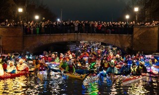 Decorated kayaks sailing through Copenhagen's canals. Photo by Lukas Bukoven