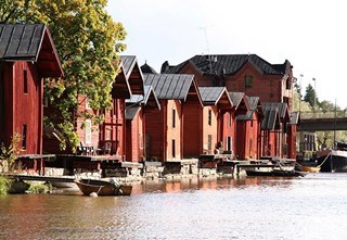 The red wooden riverside warehouses are an iconic view of Porvoo
