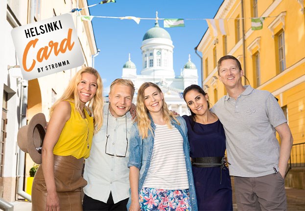 A group of smiling people posing for the camera with the Helsinki Cathedral in the background. The Helsinki Card logo is visible in the image.