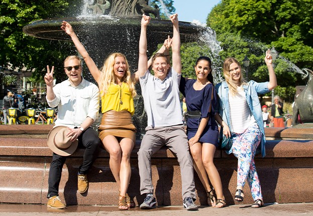 Group of people sitting at a fountain