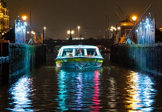 Spotlights of an artwork on the boat and colors in the water