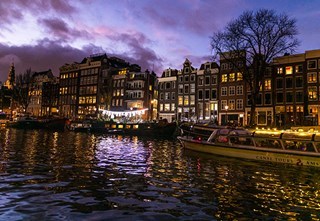 Purple sky with an artwork of laundry and a Stromma boat