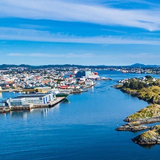 Aerial view of Haugesund with the town by the waterfront, surrounded by sea and small islands.