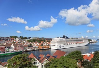 Cruise ship docked in Stavanger with the town in the background.