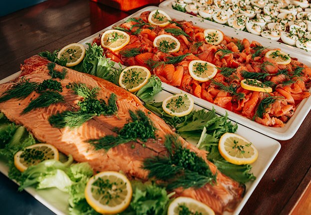 Beautifully arranged salmon with dill and lemon on the Christmas buffet of M/S Carl Michael Bellman in the Gothenburg archipelago.
