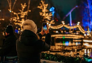 A guest taking photos of the beautifully lit-up Liseberg at Christmas