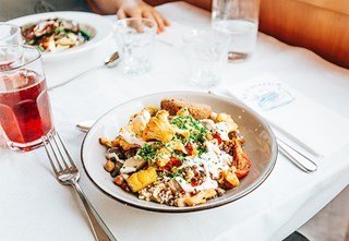 Dinner is served aboard S/S Stockholm with elegant presentations and a cozy atmosphere during the cruise.