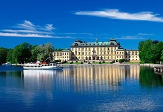 View of Drottningholm Palace from the water - Stromma turn of the century ship in front of the palace