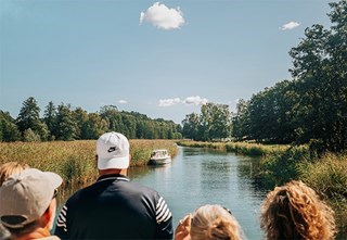 Guests enjoy the deck of M/S Strömma Kanal during the boat trip from Stockholm to Sandhamn through the archipelago.