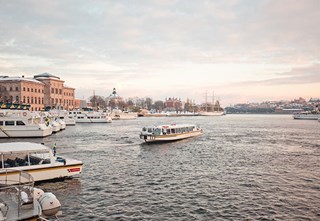 Sightseeing boat arriving at Strömkajen in Stockholm
