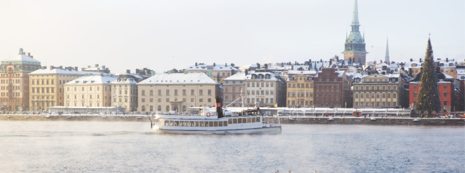 M/S Angantyr on a wintery day with sea smoke and the Old Town in the background
