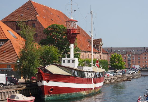 Historic red and white lightvessel moored at Frederiksholm's Kanal.