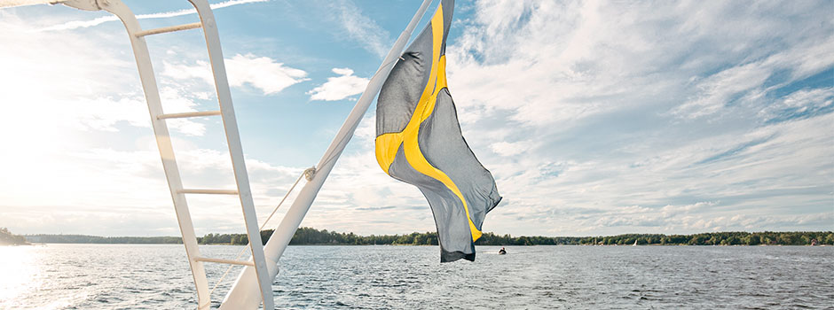 The swedish flag in the archipelago a sunny day