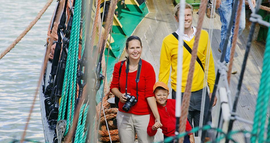 Family visiting one of the Tall Ship Races vessels