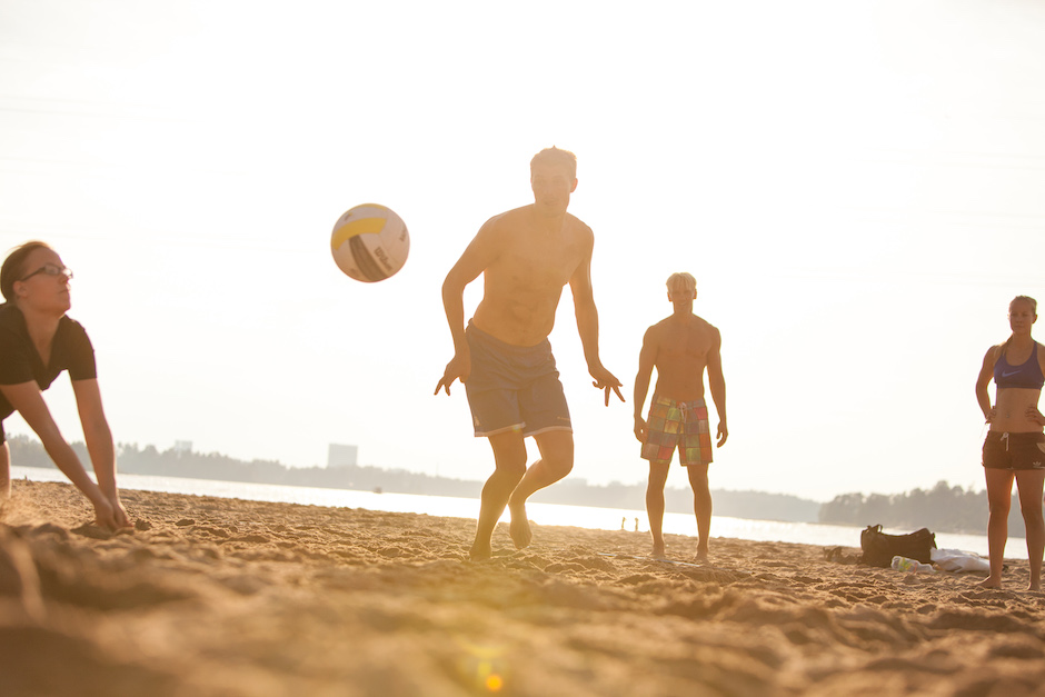 Group of people playing beach volleyball